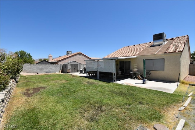 5105 Wildroot Rd, Las Vegas, NV 89130 - back of house featuring a tiled roof, a patio, a fenced backyard, and a shed