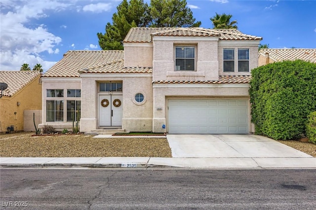 2535 Cortina Ave, Henderson, NV 89074 - mediterranean / spanish-style home with stucco siding, concrete driveway, a tiled roof, and an attached garage