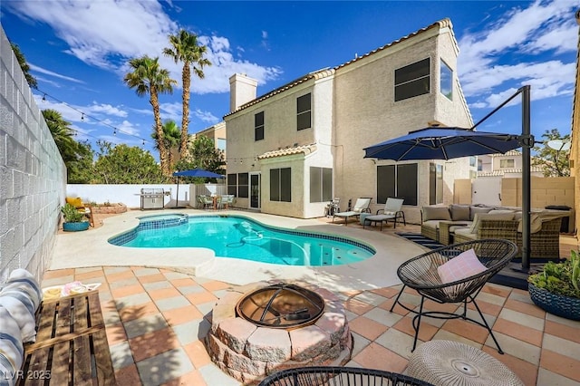2535 Cortina Ave, Henderson, NV 89074 - view of pool featuring a fenced backyard, a patio, and an outdoor living space with a fire pit