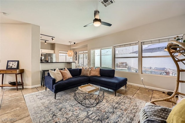 2535 Cortina Ave, Henderson, NV 89074 - living room featuring light tile patterned floors, ceiling fan, and track lighting