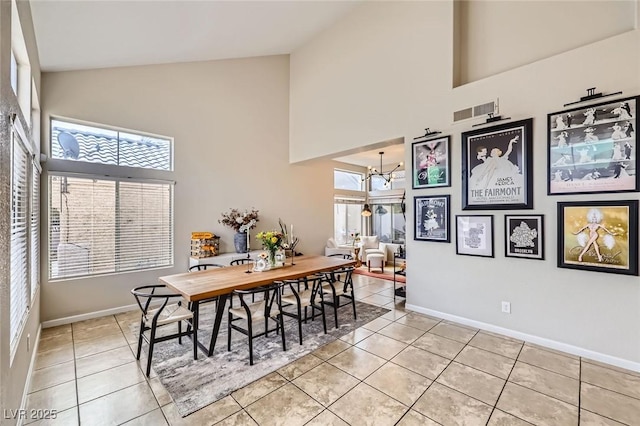 2535 Cortina Ave, Henderson, NV 89074 - dining room with high vaulted ceiling, light tile patterned floors, and a chandelier