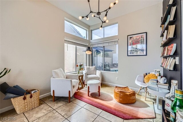 2535 Cortina Ave, Henderson, NV 89074 - sitting room with a chandelier and tile patterned floors