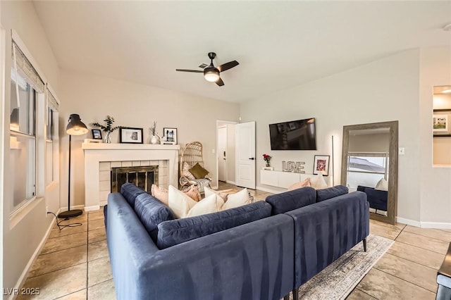 2535 Cortina Ave, Henderson, NV 89074 - living area with a ceiling fan, light tile patterned floors, and a tiled fireplace