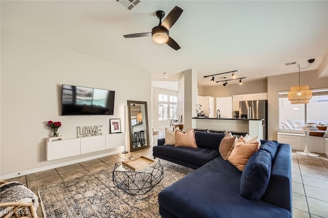 2535 Cortina Ave, Henderson, NV 89074 - living room with light tile patterned flooring and a ceiling fan