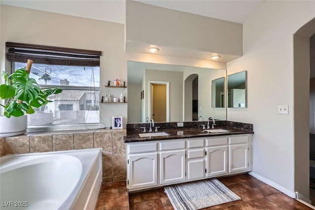 2535 Cortina Ave, Henderson, NV 89074 - bathroom featuring double vanity and a bath