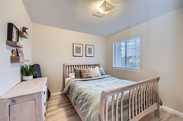 2535 Cortina Ave, Henderson, NV 89074 - bedroom featuring light wood finished floors and a textured ceiling