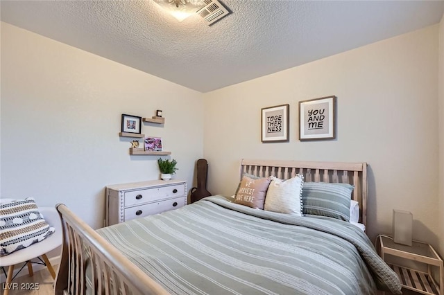 2535 Cortina Ave, Henderson, NV 89074 - bedroom featuring a textured ceiling and wood finished floors