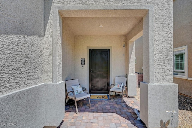 6322 Highledge St, North Las Vegas, NV 89081 - property entrance featuring stucco siding and a patio