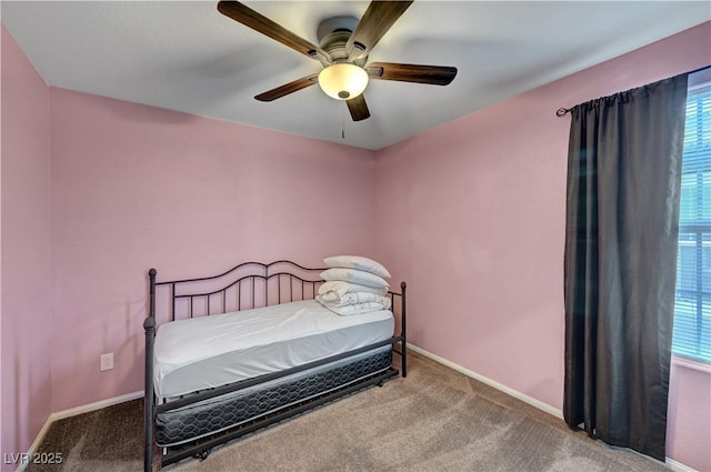 6322 Highledge St, North Las Vegas, NV 89081 - carpeted bedroom with multiple windows and ceiling fan