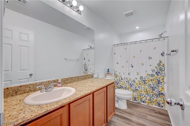 6322 Highledge St, North Las Vegas, NV 89081 - bathroom featuring wood finished floors, vanity, and a shower with curtain