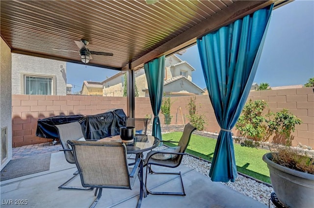 6322 Highledge St, North Las Vegas, NV 89081 - fenced backyard featuring ceiling fan, a patio, and outdoor dining area