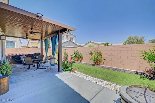 6322 Highledge St, North Las Vegas, NV 89081 - fenced backyard with ceiling fan, outdoor dining space, and a patio area