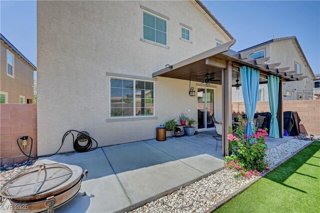 6322 Highledge St, North Las Vegas, NV 89081 - back of property with a ceiling fan, stucco siding, and a patio area
