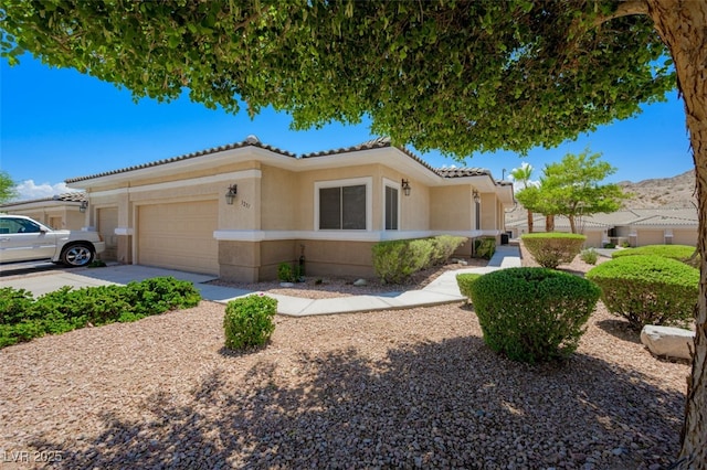 3251 Pheasant Hills Way, Laughlin, NV 89029 - view of front of property with a tiled roof, an attached garage, stucco siding, and concrete driveway