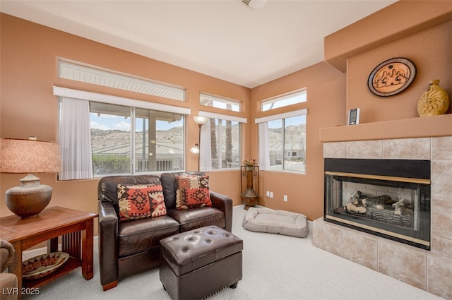 3251 Pheasant Hills Way, Laughlin, NV 89029 - carpeted living area with a tiled fireplace
