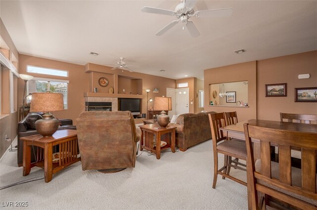 3251 Pheasant Hills Way, Laughlin, NV 89029 - living room featuring light carpet, a ceiling fan, and a tile fireplace