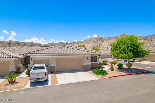 3251 Pheasant Hills Way, Laughlin, NV 89029 - ranch-style house with a mountain view, stucco siding, driveway, a garage, and a tiled roof