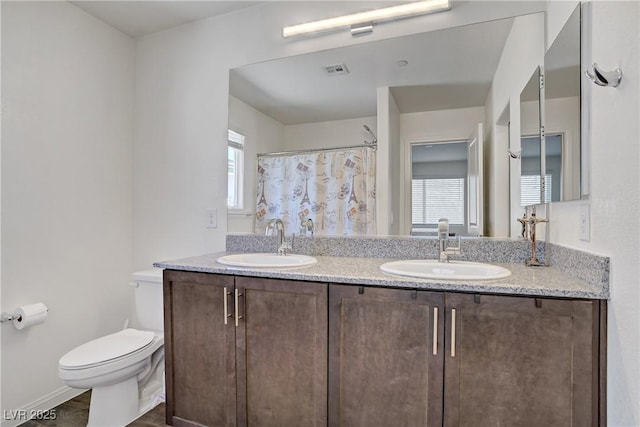 6831 Crimson Shadow St, North Las Vegas, NV 89086 - bathroom featuring double vanity and a shower with curtain