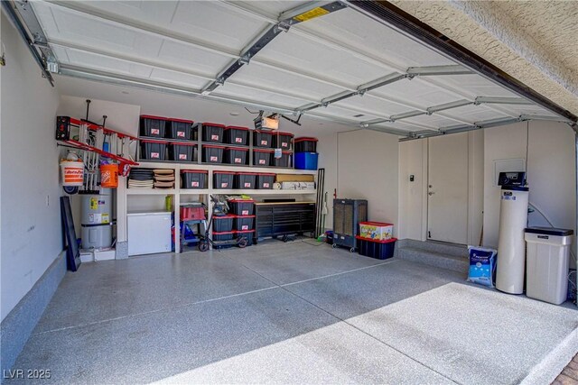 6831 Crimson Shadow St, North Las Vegas, NV 89086 - garage with secured water heater