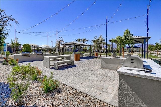 6831 Crimson Shadow St, North Las Vegas, NV 89086 - view of patio / terrace featuring a gazebo and an outdoor kitchen