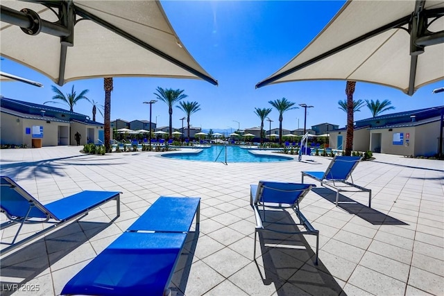 6831 Crimson Shadow St, North Las Vegas, NV 89086 - community pool with a patio area and a residential view