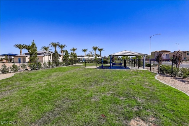 6831 Crimson Shadow St, North Las Vegas, NV 89086 - view of green lawn with a gazebo and a residential view