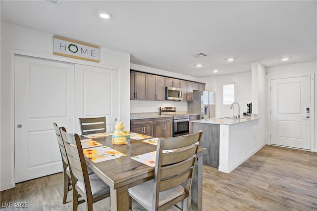 6831 Crimson Shadow St, North Las Vegas, NV 89086 - dining space featuring light wood-style floors and recessed lighting