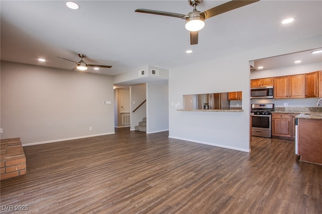 4307 Lucas Ave, Las Vegas, NV 89120 - unfurnished living room featuring ceiling fan, dark wood-style flooring, stairs, and recessed lighting