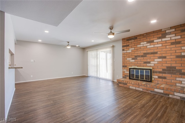4307 Lucas Ave, Las Vegas, NV 89120 - unfurnished living room with ceiling fan, a brick fireplace, wood finished floors, and recessed lighting