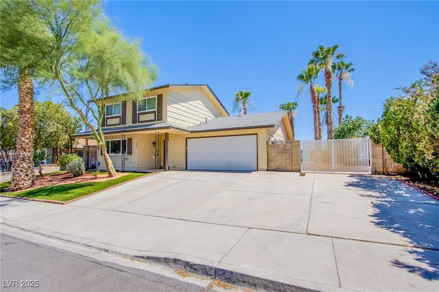 4307 Lucas Ave, Las Vegas, NV 89120 - traditional-style house featuring concrete driveway, a gate, a garage, and stucco siding
