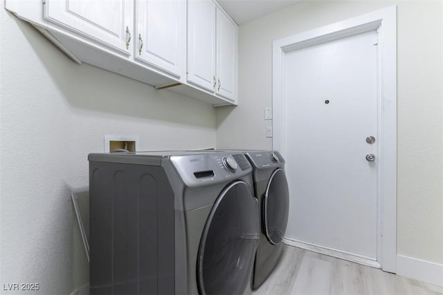 1846 Autumn Gold Ave, Las Vegas, NV 89123 - washroom with cabinet space, washing machine and clothes dryer, and light wood-style floors