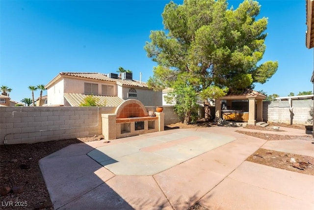 1846 Autumn Gold Ave, Las Vegas, NV 89123 - view of front of house featuring stucco siding, a patio area, a fenced backyard, and a tile roof