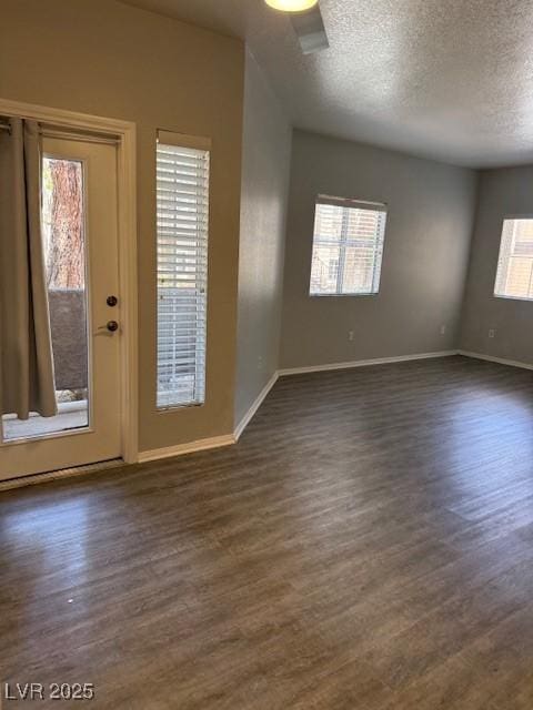 5250 S Rainbow Blvd Unit 1155, Las Vegas, NV 89118 - unfurnished room featuring dark wood-style flooring and a textured ceiling