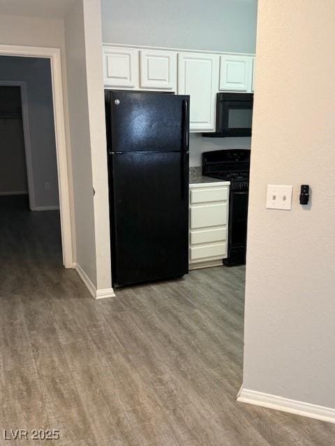 5250 S Rainbow Blvd Unit 1155, Las Vegas, NV 89118 - kitchen featuring black appliances, white cabinetry, and wood finished floors