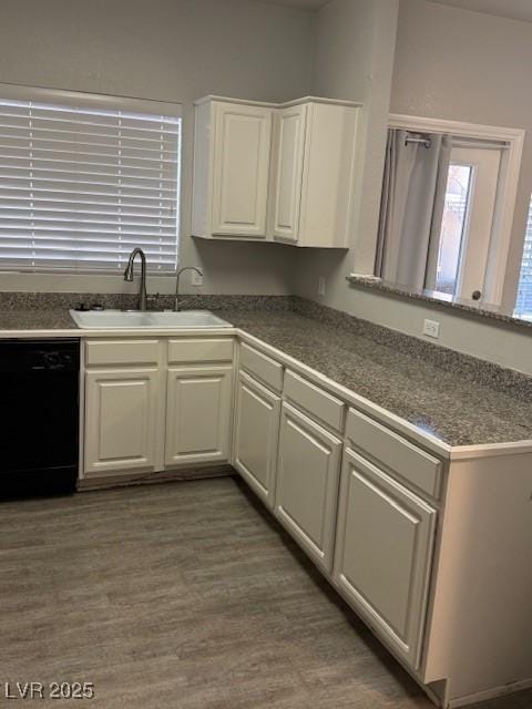 5250 S Rainbow Blvd Unit 1155, Las Vegas, NV 89118 - kitchen featuring dishwasher, white cabinetry, a peninsula, wood finished floors, and dark countertops