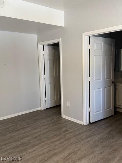 5250 S Rainbow Blvd Unit 1155, Las Vegas, NV 89118 - unfurnished bedroom featuring dark wood-type flooring
