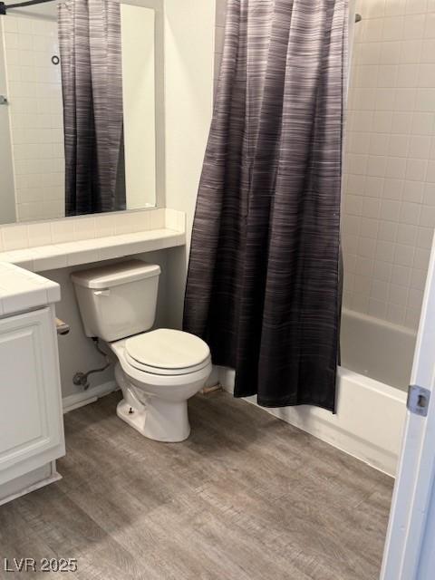 5250 S Rainbow Blvd Unit 1155, Las Vegas, NV 89118 - bathroom with wood finished floors, vanity, and shower / bathtub combination with curtain