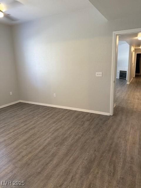 5250 S Rainbow Blvd Unit 1155, Las Vegas, NV 89118 - spare room with dark wood-style flooring and ceiling fan