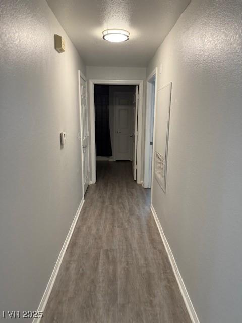 5250 S Rainbow Blvd Unit 1155, Las Vegas, NV 89118 - corridor featuring dark wood-style floors and baseboards