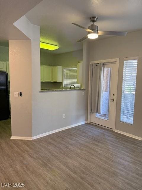 5250 S Rainbow Blvd Unit 1155, Las Vegas, NV 89118 - unfurnished living room with wood finished floors and ceiling fan