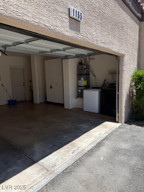 5250 S Rainbow Blvd Unit 1155, Las Vegas, NV 89118 - garage featuring independent washer and dryer and secured water heater