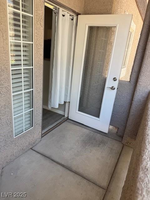 5250 S Rainbow Blvd Unit 1155, Las Vegas, NV 89118 - doorway to property with stucco siding