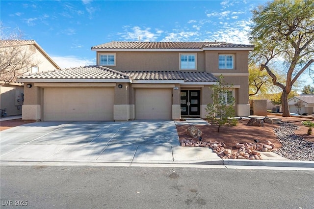 212 Stour Ln, Las Vegas, NV 89144 - mediterranean / spanish home featuring concrete driveway, stucco siding, a garage, and a tiled roof