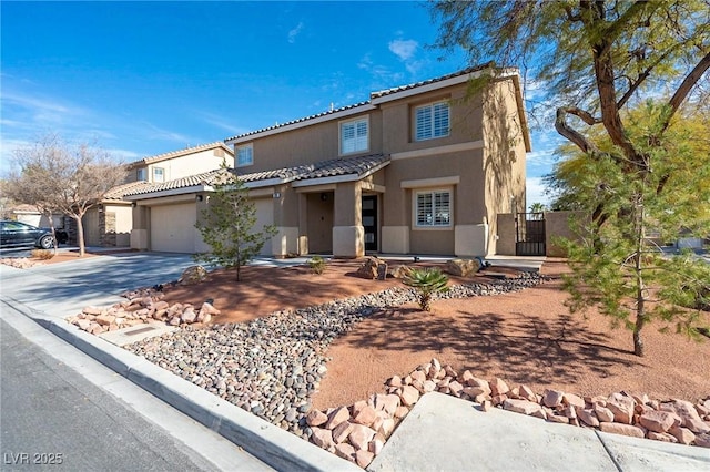 212 Stour Ln, Las Vegas, NV 89144 - view of front of property with stucco siding, driveway, a tile roof, an attached garage, and a gate