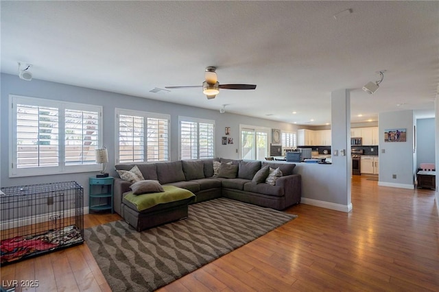 212 Stour Ln, Las Vegas, NV 89144 - living room featuring light wood-style flooring, ceiling fan, and recessed lighting