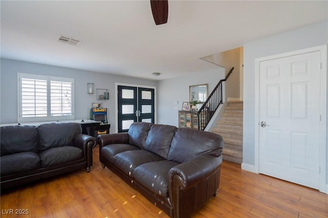 212 Stour Ln, Las Vegas, NV 89144 - living area featuring stairs, light wood-style flooring, and ceiling fan