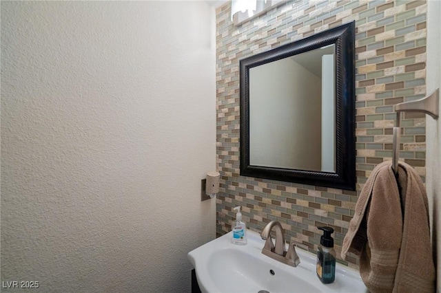 212 Stour Ln, Las Vegas, NV 89144 - bathroom featuring a sink and decorative backsplash