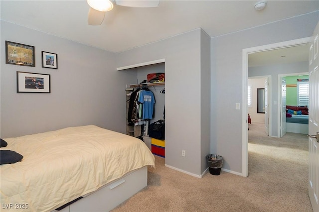212 Stour Ln, Las Vegas, NV 89144 - bedroom with light colored carpet, a closet, and ceiling fan