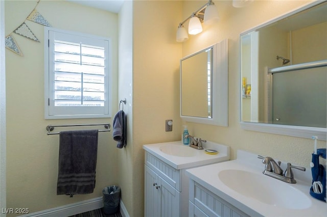 212 Stour Ln, Las Vegas, NV 89144 - bathroom featuring two vanities and a shower with shower door
