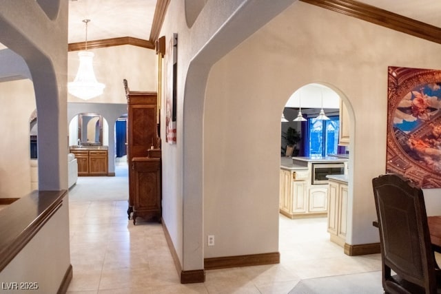 3430 Tanto Cir, Las Vegas, NV 89121 - corridor featuring arched walkways, ornamental molding, and light tile patterned floors